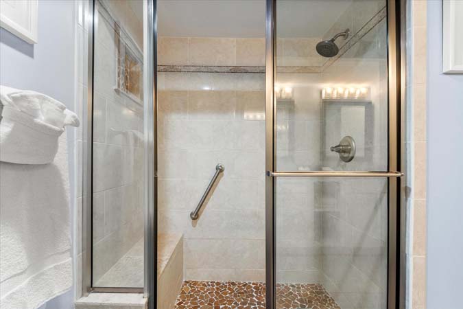 waterfront living room with balcony overlooking boats at Bayview Beauty Siesta Key