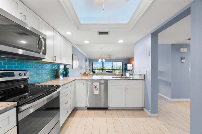 primary bathroom with double sinks and walk in shower inside Siesta Key condo