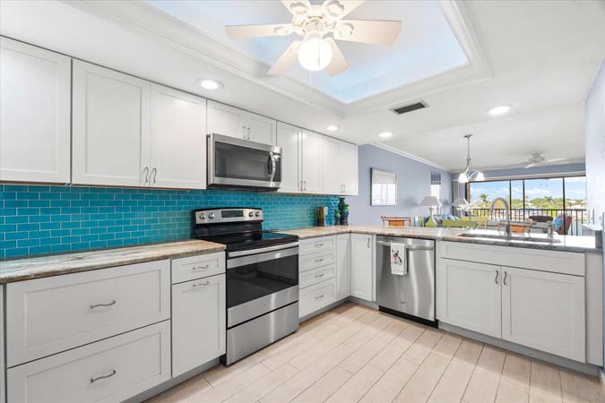 guest bedroom with queen and twin bed ideal for family vacations