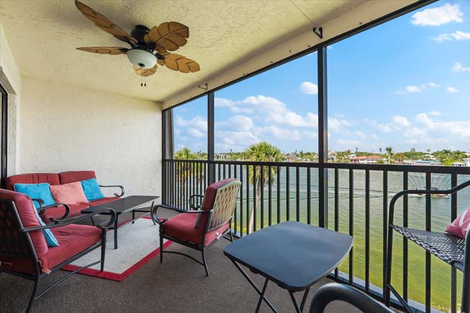 open kitchen with stainless appliances and granite counters in Siesta Key rental