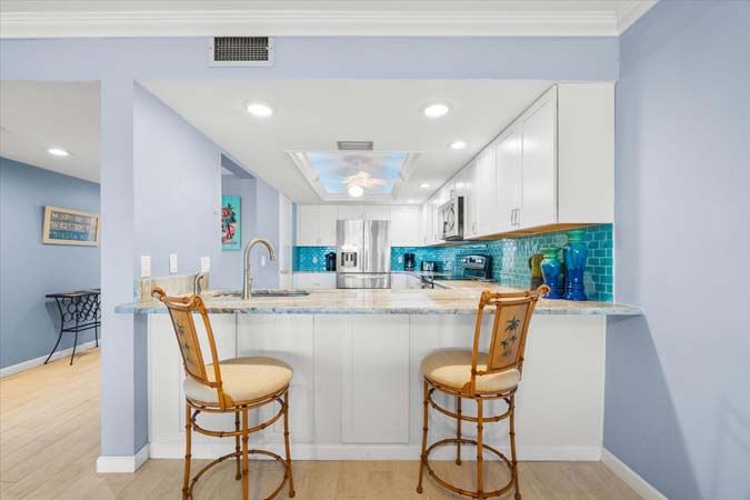 dining space with seating for four and serene bayfront views