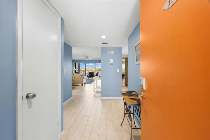 dining table for four with bright bayfront scenery inside Siesta Key condo rental