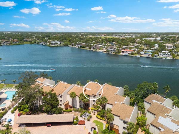living room with coastal style smart TV and balcony access