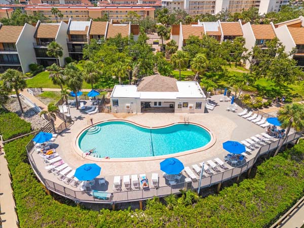 living room with balcony looking over boats and waterway in Siesta Key