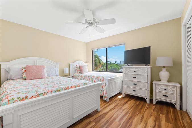 primary bedroom with king bed and ensuite bath at Bayview Beauty Siesta Key
