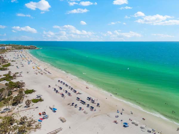 coastal living space with smart TV and balcony access at Bayview Beauty