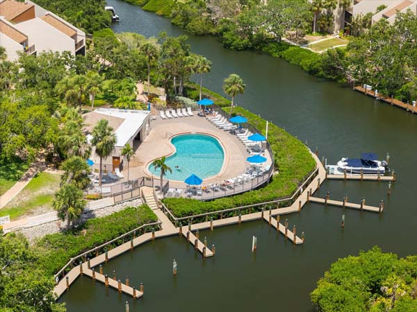 kitchen with full amenities and bar seating at Siesta Key condo