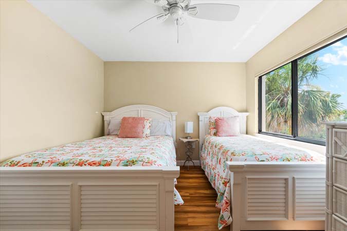 spacious bathroom with double vanity and walk in shower inside Siesta Key condo