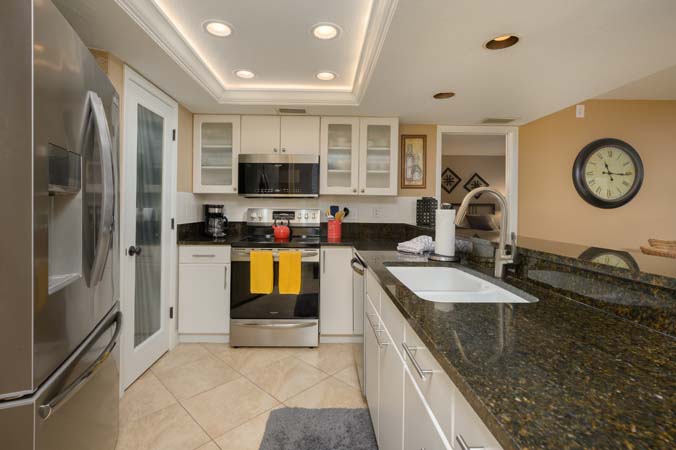 heated pool surrounded by palm trees at Sarasota Surf and Racquet Club