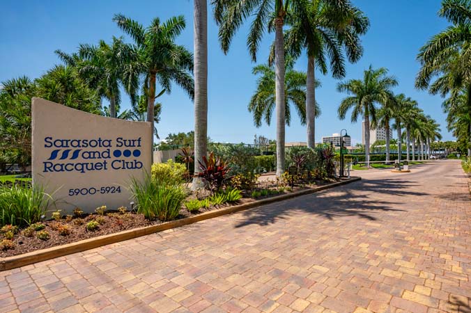 guest room with two double beds and TV at Siesta Key Gulfside condo