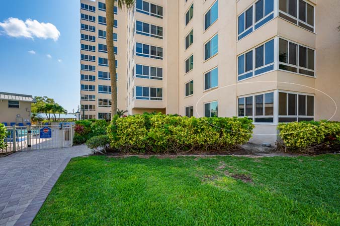 kitchen with granite surfaces and stainless appliances in Tower 0104 condo